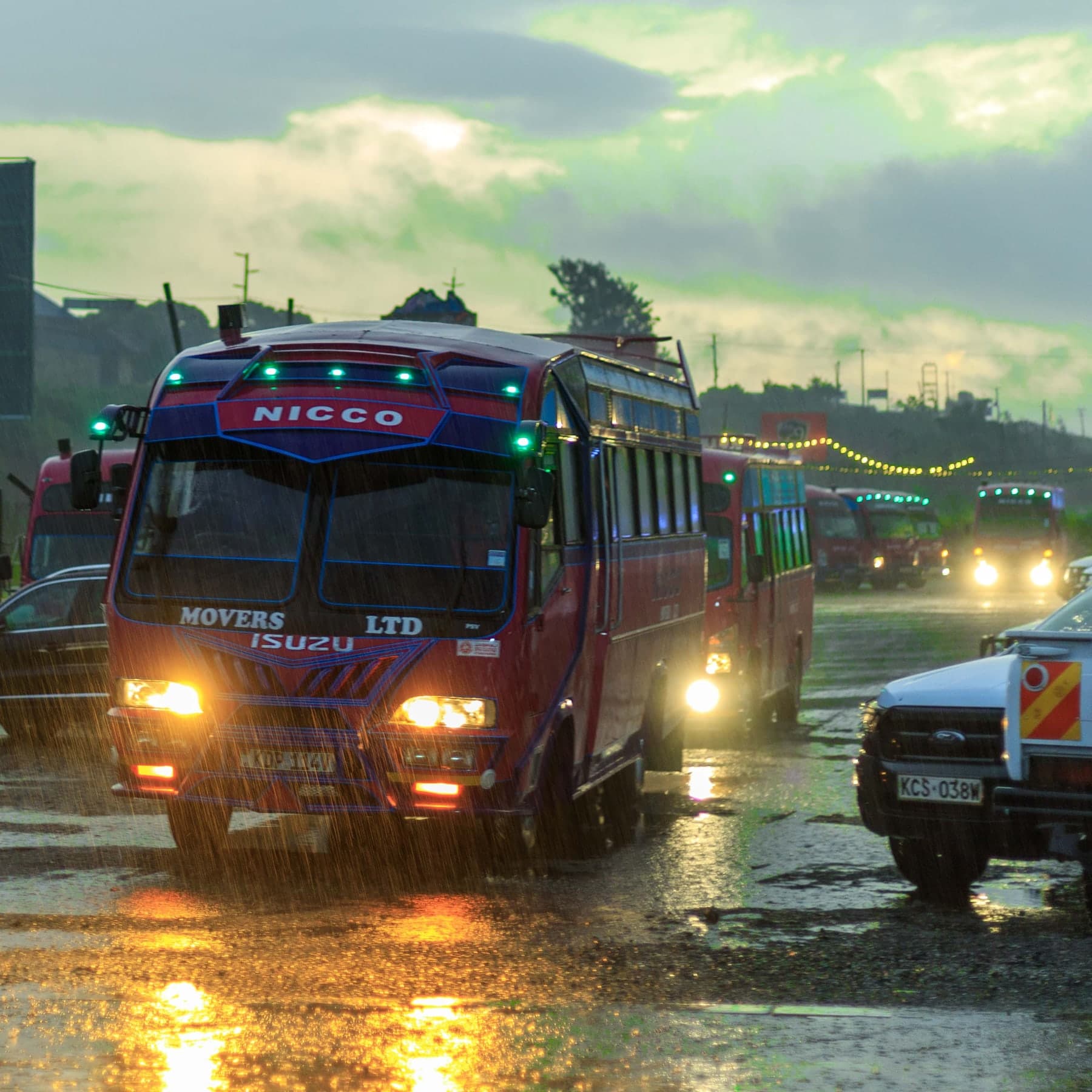 Matatus operating on a rain-swept Nairobi road